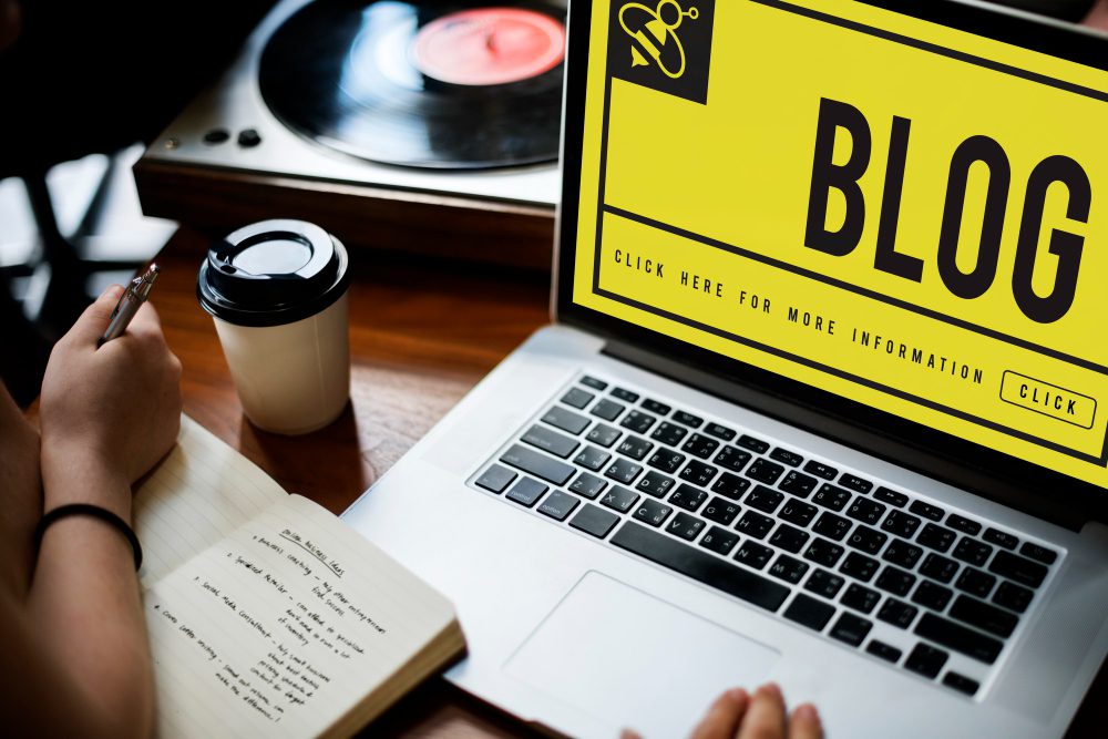 A person works on a blog.